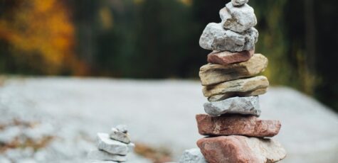 A small pile of stones next to an even larger pile of stones as a metaphor for maximising your pension