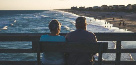 Couple sat talking about merging pension inheritance